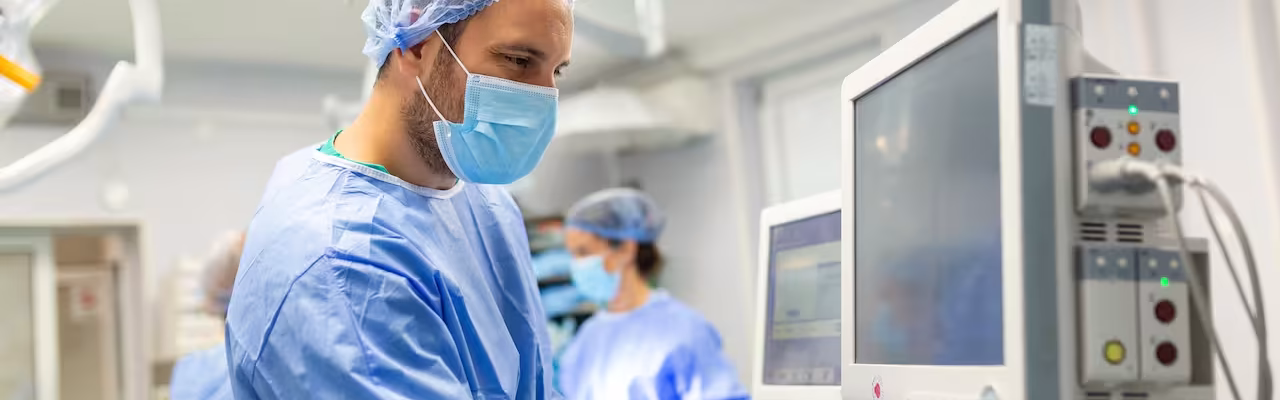medical-ventilator-being-monitored-by-anaesthetist-surgeon-using-monitor-operating-room